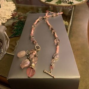 Pink beaded necklace with Silver accent beads.